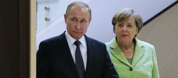 Vladimir Putin i Angela Merkel - Sputnik Srbija