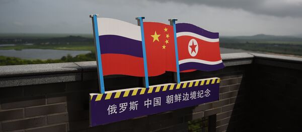 Zastave Rusije, Kine i Severne Koreje - Sputnik Srbija