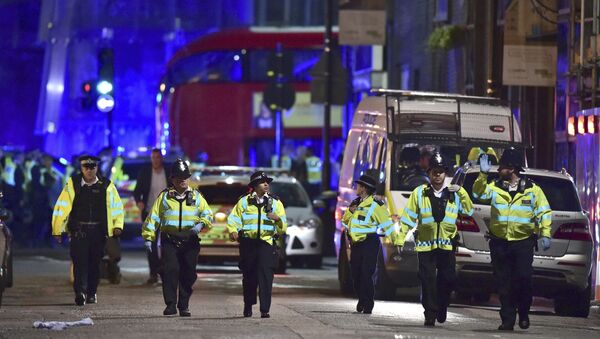 Police officers on Borough High Street as police are dealing with an incident on London Bridge in London, Saturday, June 3, 2017. - Sputnik Srbija