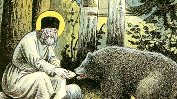 Серафим Саровски храни медведа - Sputnik Србија