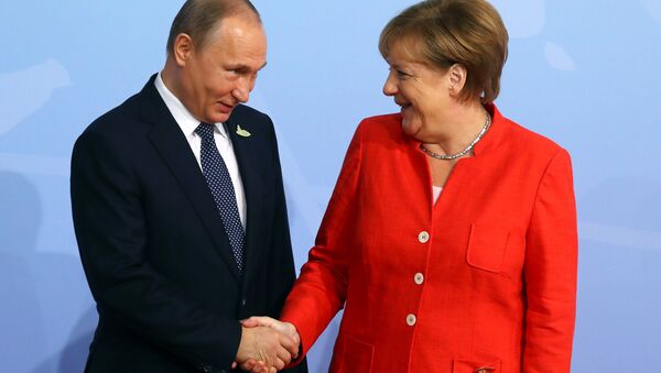Nemačka kancelarka Angela Merkel i ruski predsednik Vladimir Putin na samitu G20 u Hamburgu - Sputnik Srbija