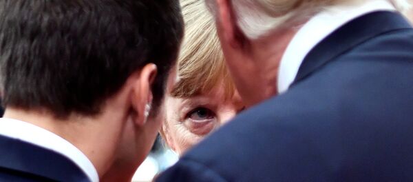 Angela Merkel između Donalda Trampa i Emanuela Makrona Angela Merkel između Donalda Trampa i Emanuela Makrona - Sputnik Srbija
