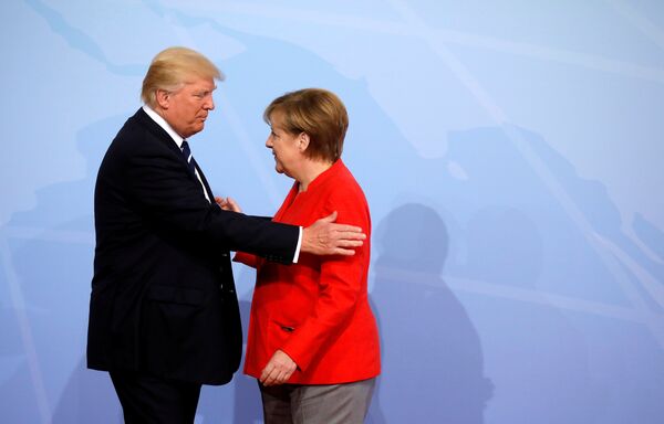 Nemačka kancelarka Angela Merkel i predsednik SAD Donald Tramp na otvaranju samita G20 u Hamburgu - Sputnik Srbija