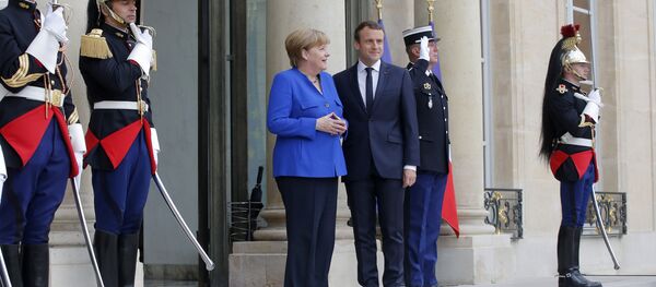 Emanuel Makron i Angela Merkel Emanuel Makron i Angela Merkel - Sputnik Srbija
