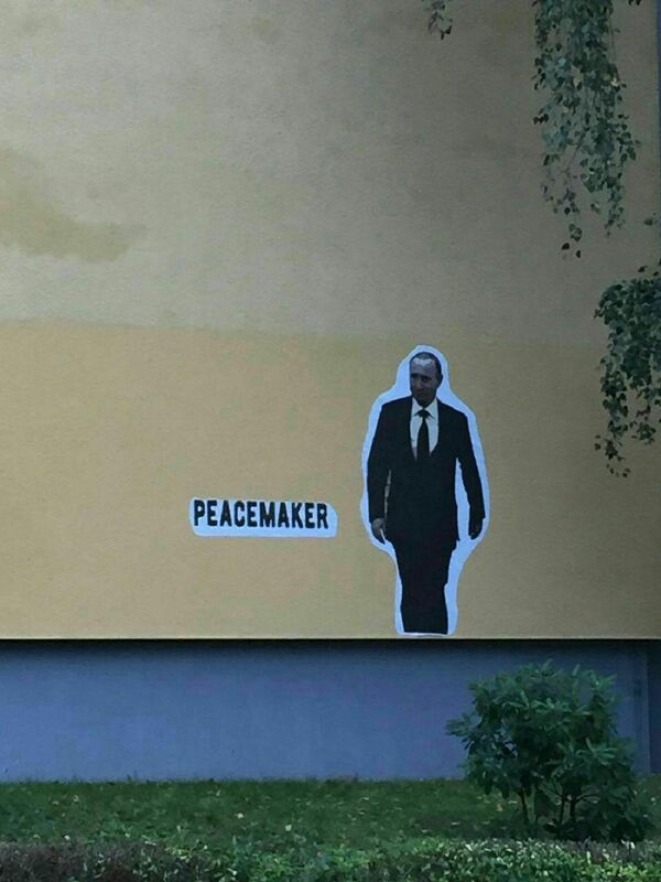 Графит са ликом председника Русије Владимира Путина у Дрездену. - Sputnik Србија