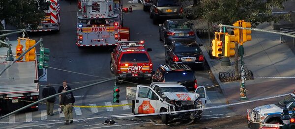 Emergency crews attend the scene of an alleged shooting incident on West Street in Manhattan, New York, U.S., October 31 2017. Emergency crews attend the scene of an alleged shooting incident on West Street in Manhattan, New York, U.S., October 31 2017. - Sputnik Србија