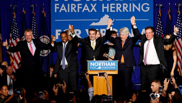 Virginia Governor Elect Ralph Northam (C) celebrates with, left to right, Gov. Terry McAuliffe, Lt. Governor Elect Justin Fairfax, Attorney General Mark Herring and Sen. Mark Warner (D-VA), at his election night rally on the campus of George Mason University in Fairfax, Virginia, November 7, 2017. REUTERS/Aaron P. Bernstein - Sputnik Србија