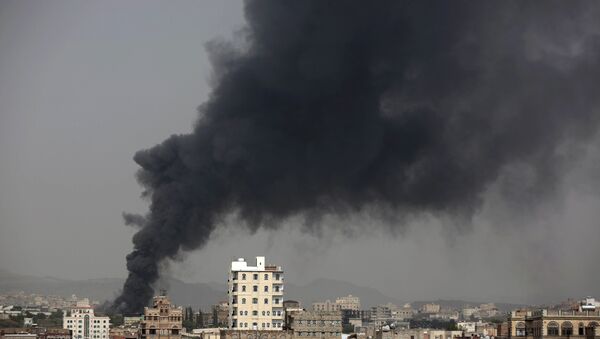 Smoke rises after Saudi-led airstrikes hit a food factory in Sanaa, Yemen. (File) - Sputnik Србија