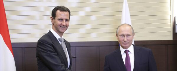 Председници Сирије и Русије Башар Асад и Владимир Путин на састанку у Сочију - Sputnik Србија