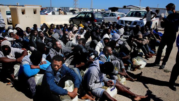 Илегални мигранти снимљени у Триполију после спасавања - Sputnik Србија