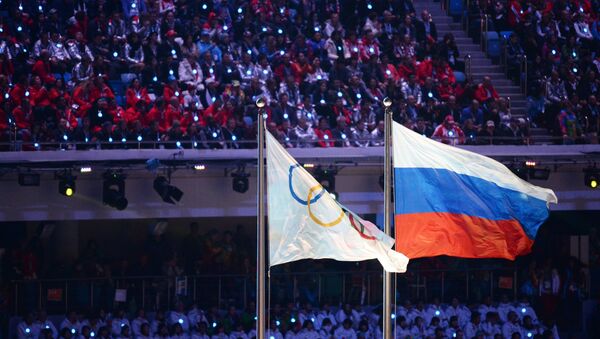 Olimpijska i ruska zastava na ceremoniji zatvaranja Olimpijskih igara u Sočiju 2014. - Sputnik Srbija