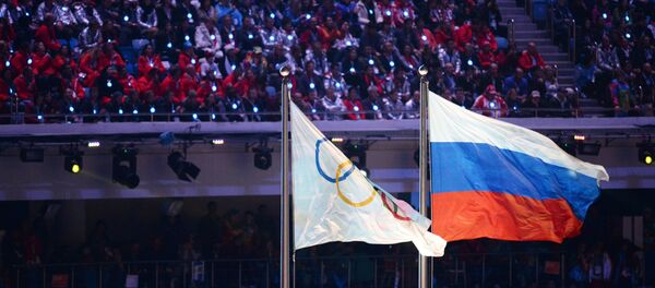 Олимпијска и руска застава на церемонији затварања Олимпијских игара у Сочију 2014. - Sputnik Србија