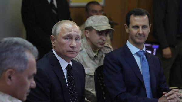 Председници Русије и Сирије, Владимир Путин и Башар Асад на састанку у војној бази Хмејмим у Сирији - Sputnik Србија