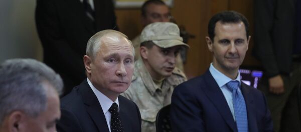 Председници Русије и Сирије, Владимир Путин и Башар Асад на састанку у војној бази Хмејмим у Сирији - Sputnik Србија