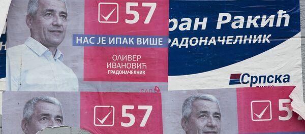 Поцепани предизборни плакати Оливера Ивановића у Косовској Митровици 16. јануара 2018. на дан кад је убијен. Поцепани предизборни плакати Оливера Ивановића у Косовској Митровици 16. јануара 2018. на дан кад је убијен. - Sputnik Србија