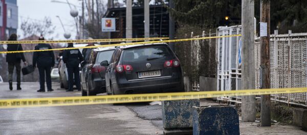 Косовски полицајци на месту где је убијен Оливер Ивановић у Косовској Митровици. - Sputnik Србија