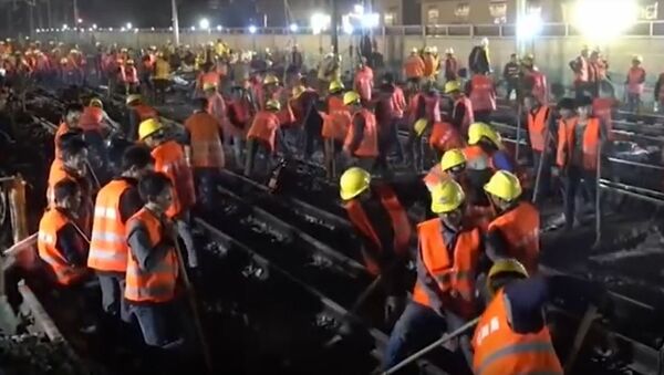1.500 radnika iz Kine izgradili prugu za 9 sati. - Sputnik Srbija