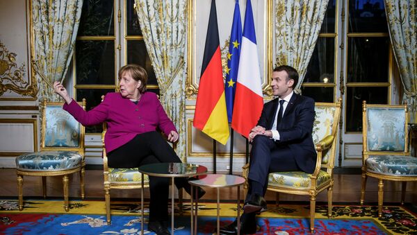 Angela Merkel i Emanuel Makron u Jelisejskoj palati u Parizu. - Sputnik Srbija