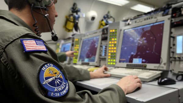 A controller monitors is seen screening aboard a NATO AWACS (Airborne Warning and Control Systems) aircraft during a surveillance flight over Romania in this April 16, 2014. - Sputnik Srbija