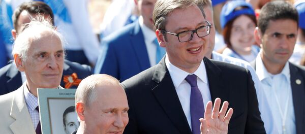 Председник Русије Владимир Путин и председик Србије Александар Вучић у акцији Бесмртни пук у Москви. Председник Русије Владимир Путин и председик Србије Александар Вучић у акцији Бесмртни пук у Москви. - Sputnik Србија