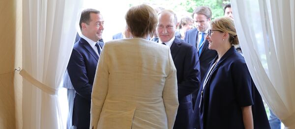 Anglea Merkel i Vladimir Putin Anglea Merkel i Vladimir Putin - Sputnik Srbija