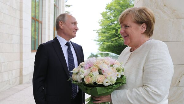 Председник Русије Владимир Путин и немачка канцеларка Ангела Меркел - Sputnik Србија