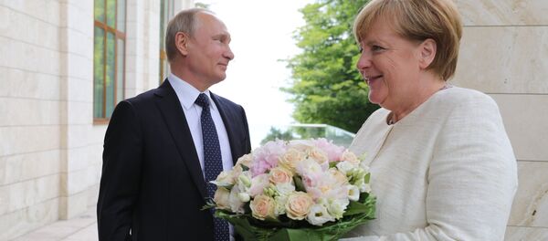Председник Русије Владимир Путин и немачка канцеларка Ангела Меркел - Sputnik Србија
