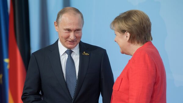 Руски председник Владимир Путин и немачка канцеларка Ангела Меркел - Sputnik Србија