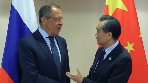 Ministri spoljnih poslova Rusije i Kine, Sergej Lavrov i Vang Ji - Sputnik Srbija