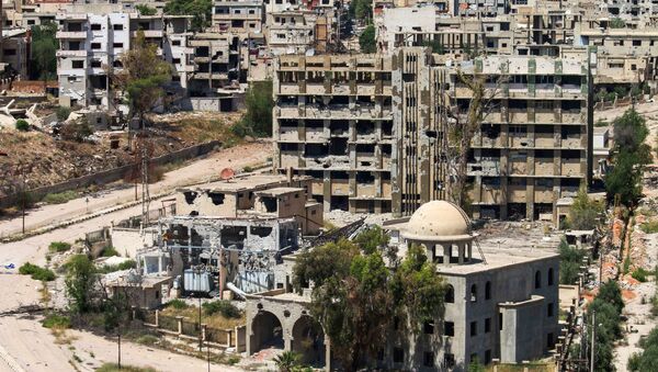 Поглед на уништене зграде у сиријском граду Дара - Sputnik Србија