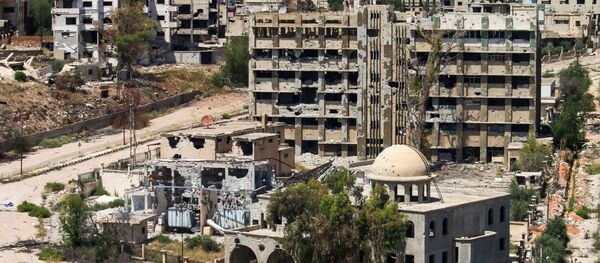 Pogled na uništene zgrade u sirijskom gradu Dara Pogled na uništene zgrade u sirijskom gradu Dara - Sputnik Srbija