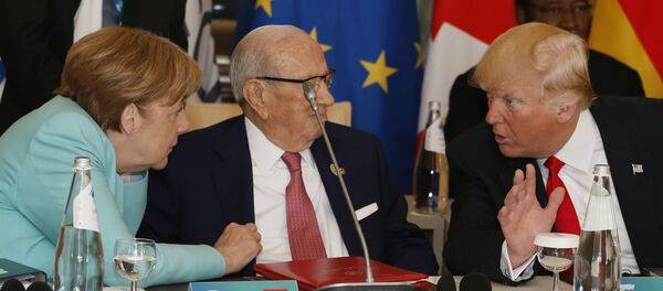 Angela Merkel i Donald Tramp  na Samitu G7 - Sputnik Srbija