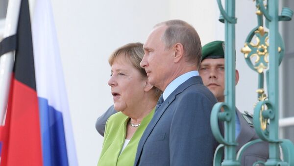 Председник Владимир Путин и канцеларка Немачке Ангела Меркел у Берлину - Sputnik Србија