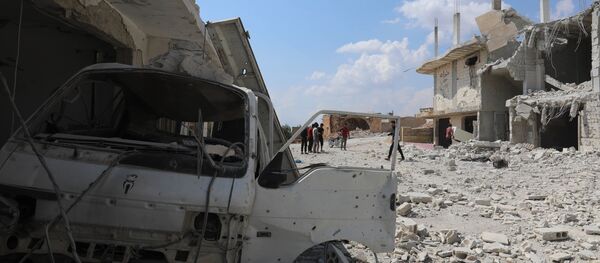 Разрушене зграде након бомбардовања града Ел Хабит на југу провинције Идлиб у Сирији - Sputnik Србија