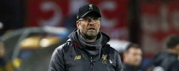 Јирген Клоп са цветом Наталијина рамонда Јирген Клоп са цветом Наталијина рамонда - Sputnik Србија