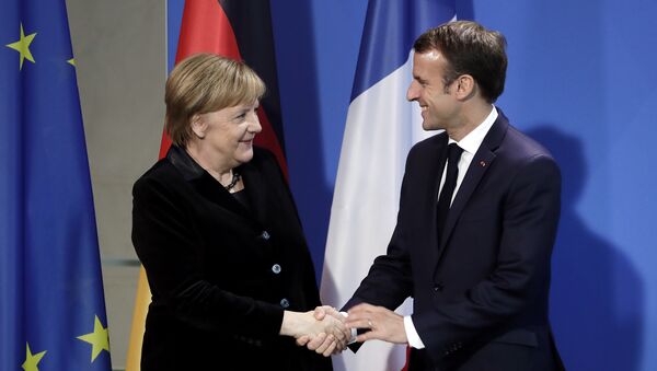 Angela Merkel i Emanuel Makron  - Sputnik Srbija
