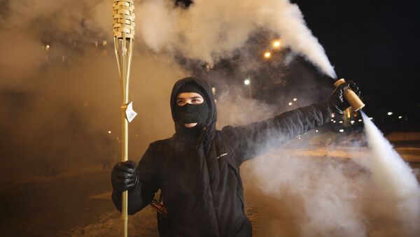 Demonstrant u Kijevu na obeležavanju godišnjice Evromajdana - Sputnik Srbija