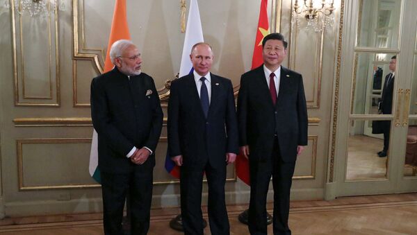 Председник Русије Владимир Путин, председник Кине Си Ђинпинг и премијер Индије Нарендра Моди - Sputnik Србија