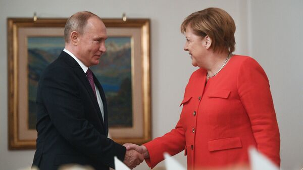 Predsednik Rusije Vladimir Putin i nemačka kancelarka Angela Merkel - Sputnik Srbija