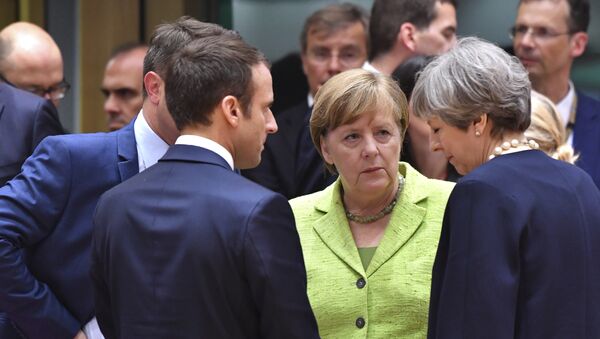 Predsednik Francuske Emanuel Makron, nemačka kancelarka Angela Merkel i britanska premijerka Tereza Mej - Sputnik Srbija