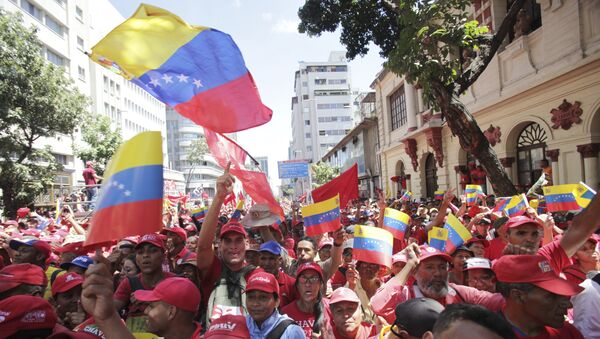 Pristalice predsednika Venecuele Nikolasa Madura na mitingu u Karakasu - Sputnik Srbija