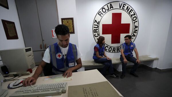Радници Црвеног крста Венецуеле у Каракасу - Sputnik Србија