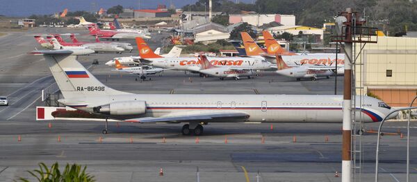 Руски војни авион Иљушин Ил-62М на аеродрому у Мајкетији, на северу Венецуеле Руски војни авион Иљушин Ил-62М на аеродрому у Мајкетији, на северу Венецуеле - Sputnik Србија