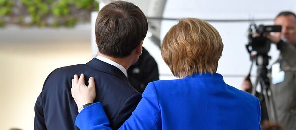 Емануел Макрон и Ангела Меркел Емануел Макрон и Ангела Меркел - Sputnik Србија