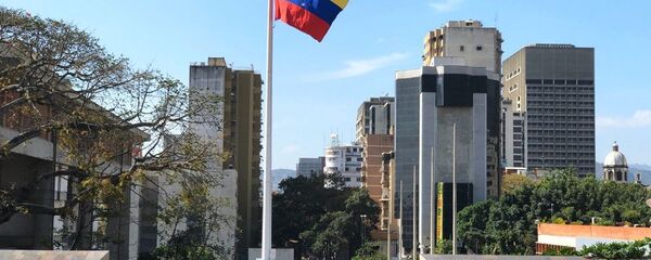 Zastava Venecuele na ulici u Karakasu Zastava Venecuele na ulici u Karakasu - Sputnik Srbija