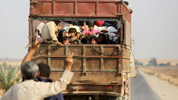 Kurdski civili u Siriji napuštaju domove ispred turske vojske - Sputnik Srbija