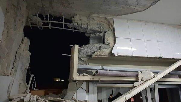 Зграда оштећена у ваздушном нападу Израела на Сирију - Sputnik Србија