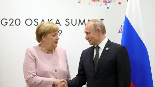 Немачка канцеларка Ангела Меркел и председник Русије Владимир Путин - Sputnik Србија