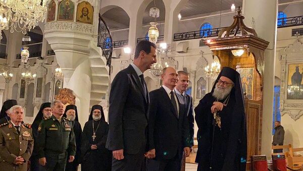 Председник Русије Владимир Путин и председник Сирије Башар Асад у цркви Девице Марије у Дамаску - Sputnik Србија