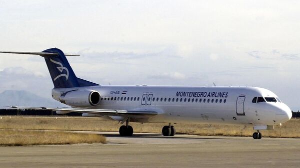 Avion kompanije Montenegro erlajnz na aerodromu Golubovci. Arhivska fotografija - Sputnik Srbija